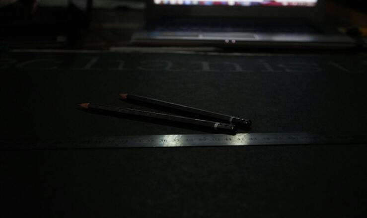 Digital caliper on a dark surface used as a physical measurement instrument